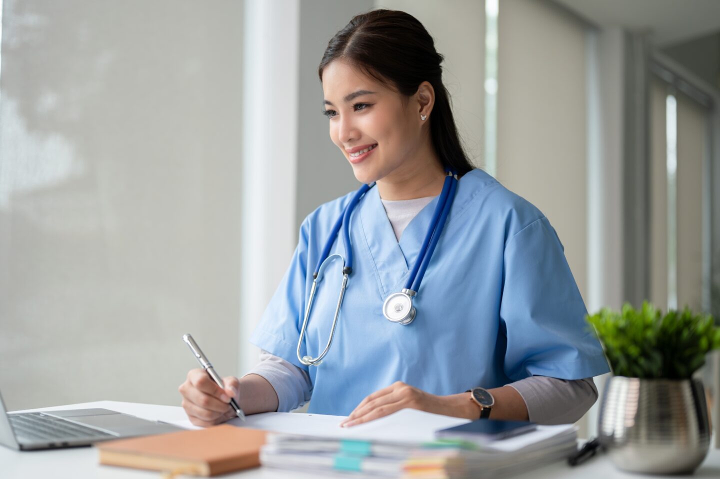 An,Attractive,And,Professional,Asian,Female,Doctor,Working,On,Her