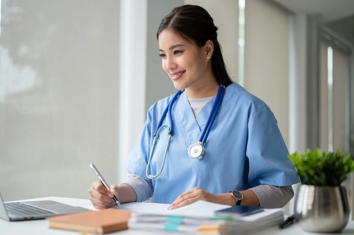 An,Attractive,And,Professional,Asian,Female,Doctor,Working,On,Her