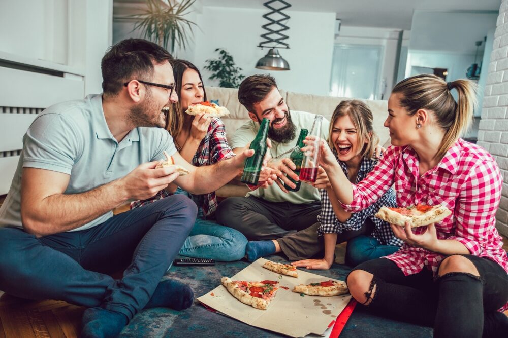 Group,Of,Young,Friends,Eating,Pizza.home,Party.fast,Food,Concept.